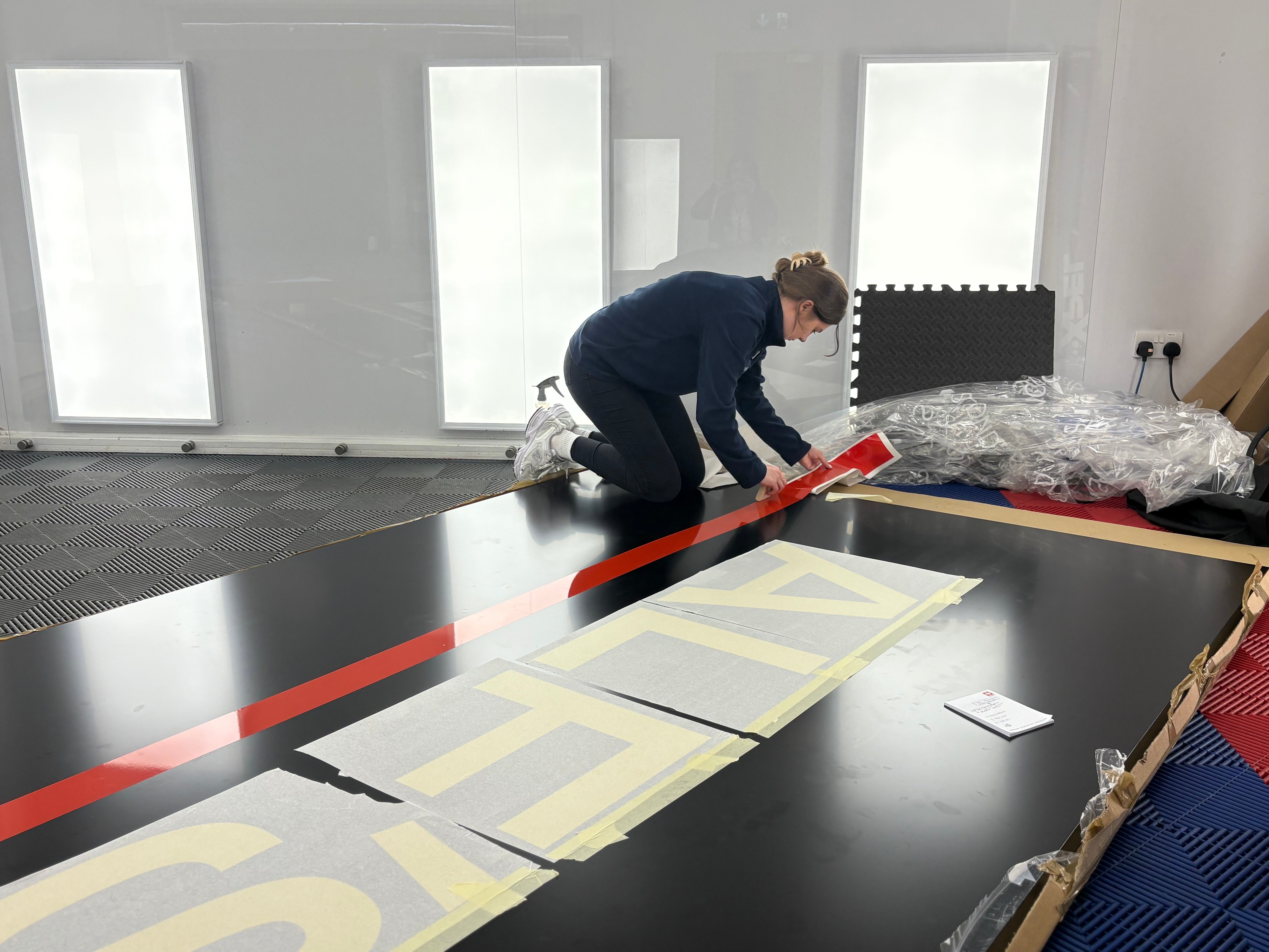 Morgan applying graphics to large outdoor casino sign