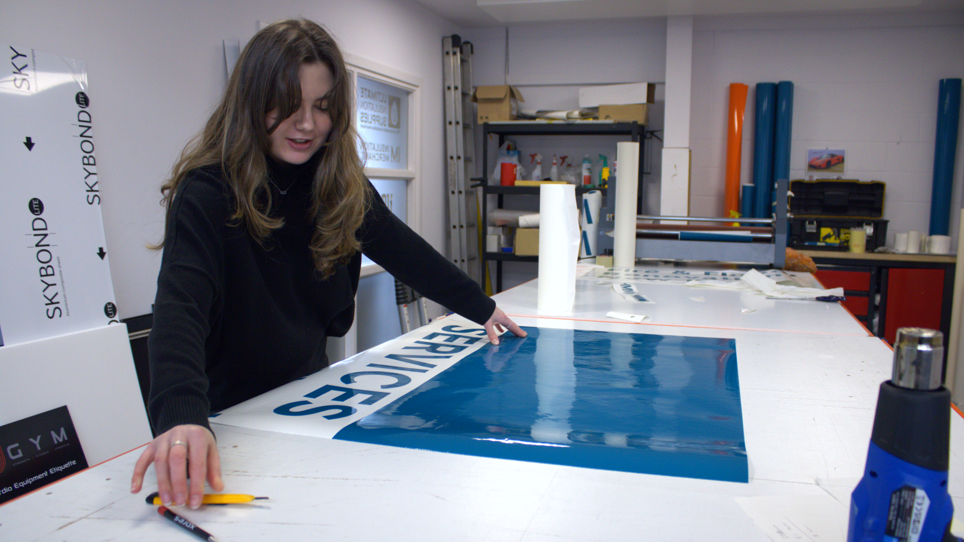 Advance Supplies Team working on van graphics