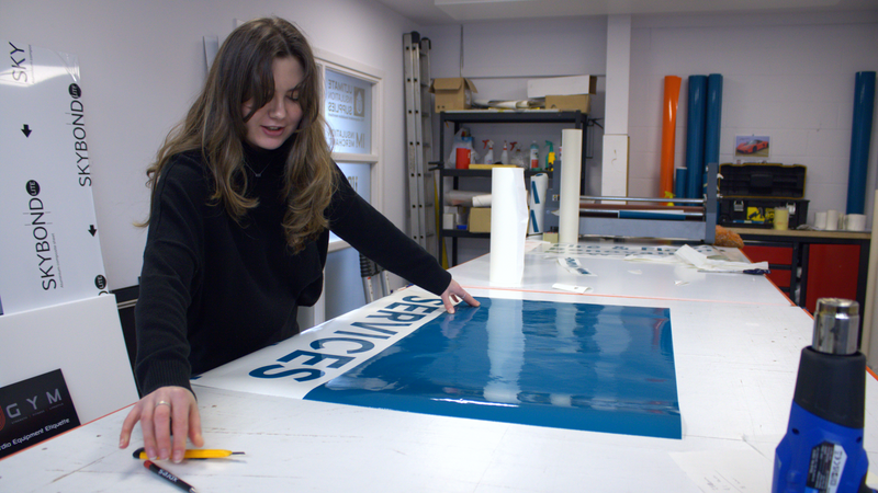 Advance Supplies Team working on van graphics